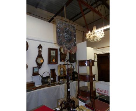 A 19th century mahogany pole screen with beaded panel