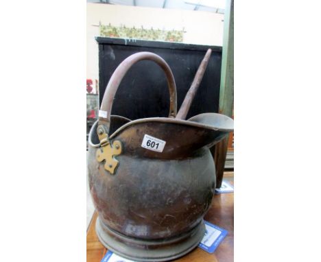 A copper scuttle and a wooden ladle