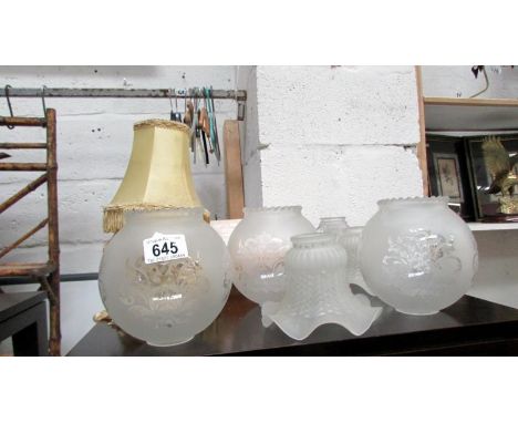 A quantity of glass and fabric lamp shades