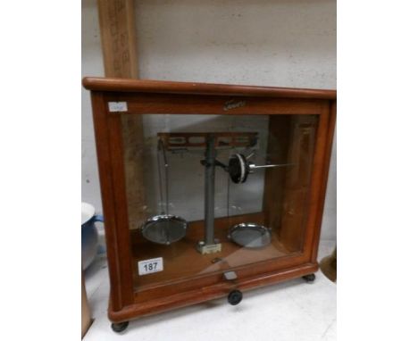 A cased set of apothecary scales