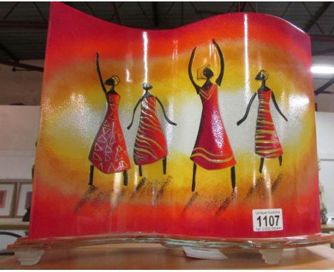 A retro style glass table lamp depicting African women figures