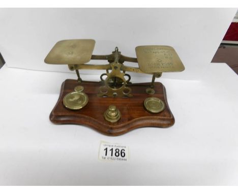 A set of Victorian brass postal scales and weights