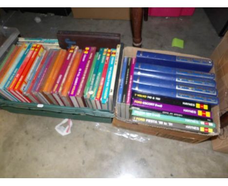 2 boxes of car manuals