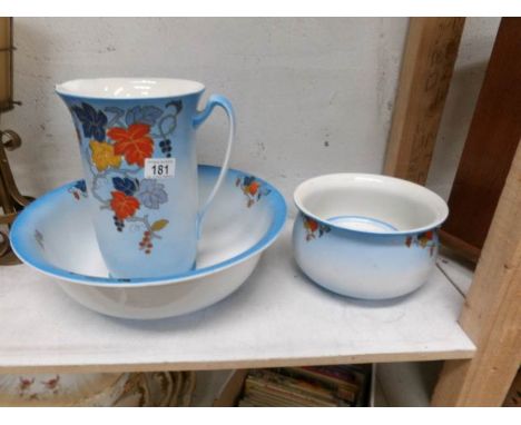 A 4 piece jug and basin set, soap dish missing lid, crack to chamber pot