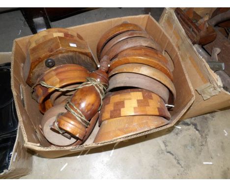 A box of turned wood bowls and a table lamp