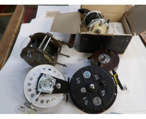A vintage boxed fishing reel and 4 others