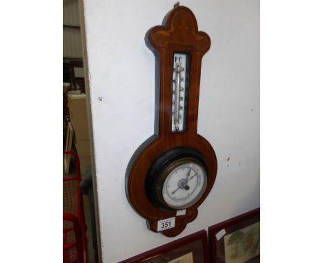 A small inlaid barometer
