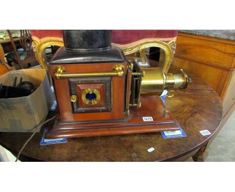 A superb quality Victorian magic lantern projector with wooden case