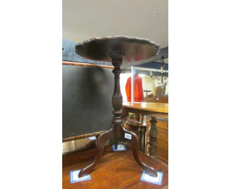 A mahogany wine table on tripod base and with leather inset top