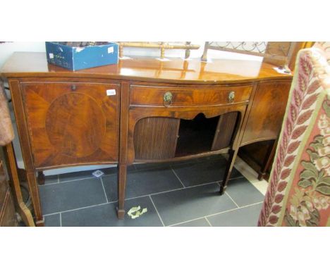 A mahogany bow front sideboard