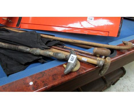 7 various walking sticks and umbrella's including silver top, porcelain top and one made completely of horn
All in poor to fa