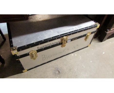 A metal travel trunk