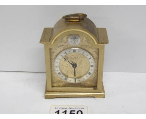 A miniature Swiss brass carriage clock