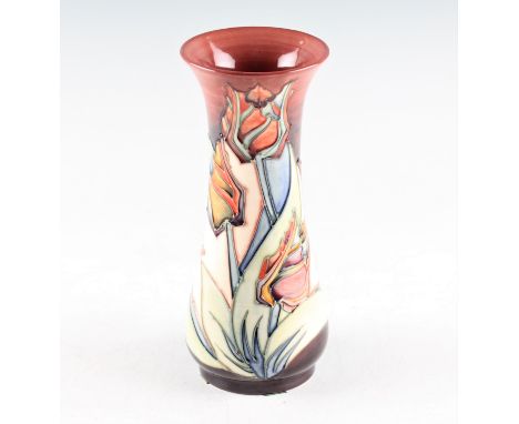 A Moorcroft Sally Tuffin vase with Red Tulip pattern with candlestick stamp to base. Height 21cm.