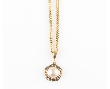 A hallmarked 9ct yellow gold mabe pearl and diamond set pendant, on a hallmarked 9ct yellow gold curb link chain.