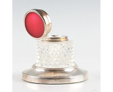 A silver inkwell stand with a glass, silver and guilloche enamel lidded inkwell, both inkwell and stand hallmarked Birmingham
