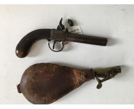 An percussion capped screw octagonal barrelled pistol together with a leather bodied powder flask.