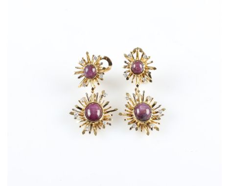 A pair of 1970s 18ct yellow gold star ruby and diamond dropper clip-on earrings, each set with an oval star ruby cabochon, me