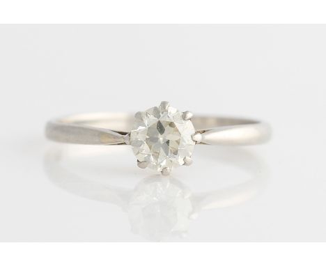 A diamond solitaire ring, set with a transitional cut diamond, measuring approx. 0.55ct, with raised shoulders, unmarked whit