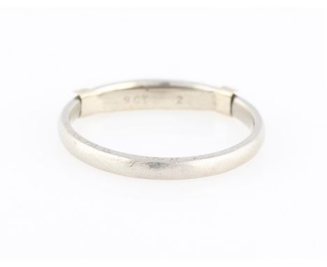 A plain wedding band, stamped PLAT, ring size M, (fitted with size adjuster stamped 9ct).