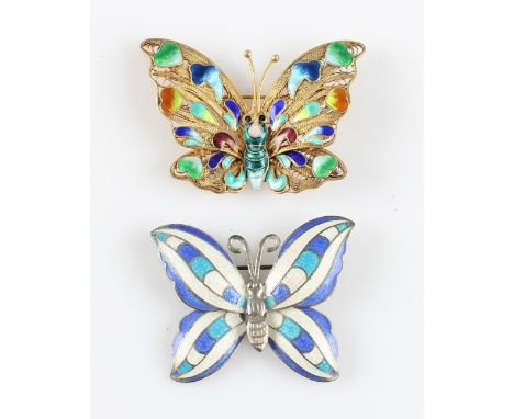 A filigree butterfly brooch, with multi-coloured enamel to body, stamped silver, together with another butterfly brooch, havi