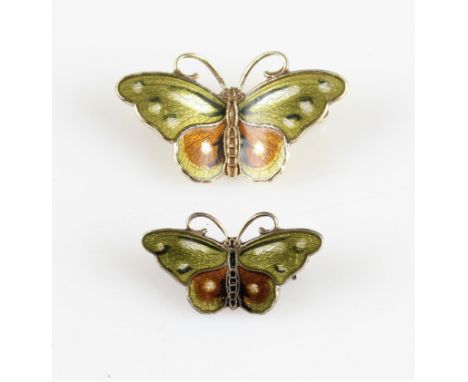 Two butterfly brooches, each having green, white and brown enamel to bodies, one being slightly larger than the other, both s