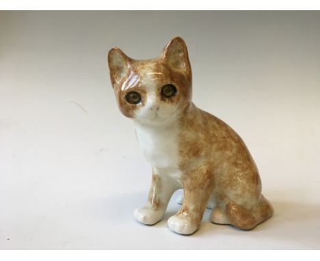 A Jenny Winstanley ceramic cat with glass eyes.