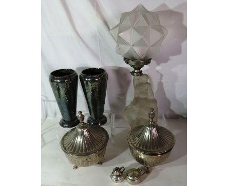 A glass art deco lamp with a young lady sitting on a rock, a pair of metal vases, pair of metal lidded pots and other items.
