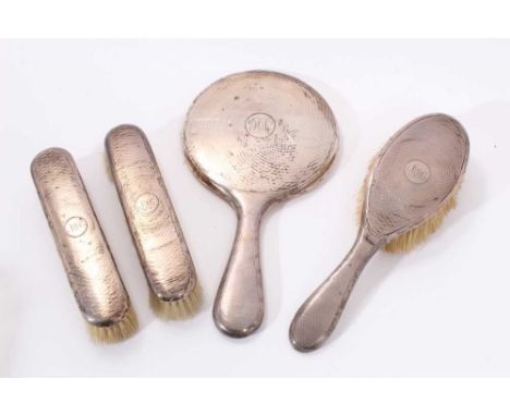 Early 20th century silver mounted, four piece dressing table set, comprising a pair of hair brushes, and one other, and a fac