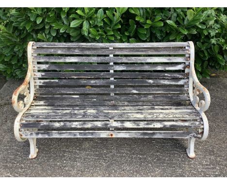 Victorian style cast iron garden bench with wooden slats