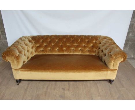 Victorian chesterfield with buttoned velvet upholstery, raised on ring turned legs and castors, 190cm wideUpholstery is ok. O