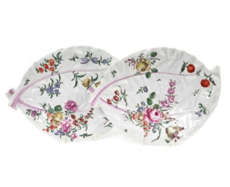 Pair 18th century Worcester cabbage leaf-shaped dishes, polychrome painted in ‘Rogers’ style with flowers and fruit, circa 17
