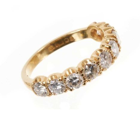 Diamond nine stone half hoop eternity ring with nine brilliant cut diamonds in 18ct yellow gold setting, London 1979. Estimat