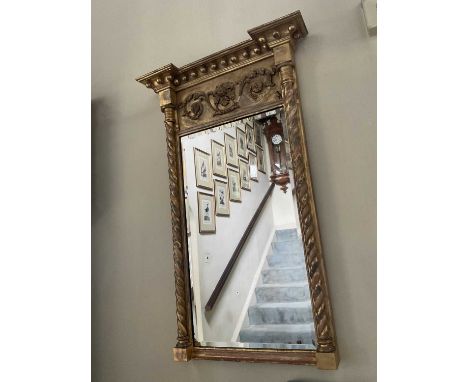 Regency gilt pier mirror, with ball mounted cornice and bevelled rectangular plate between projecting twist columns, 96 x 51c