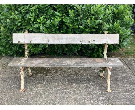 Victorian cast iron garden bench with rustic branch design and wooden slats