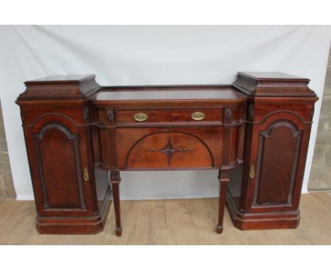 Late 19th / early 20th century mahogany pedestal sideboard, central bowed section with two drawers and flanking enclosed cupb