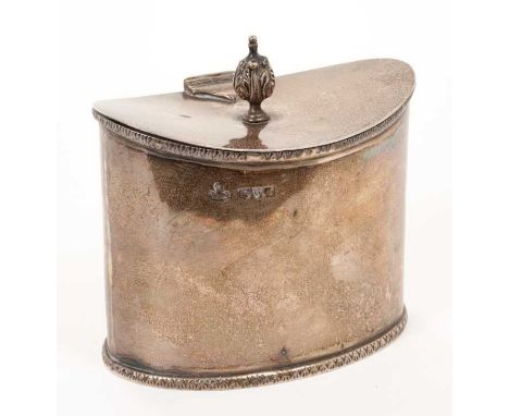 George V silver tea caddy of navette form, in the Regency style, with arrow head borders and hinged concave cover, with flowe