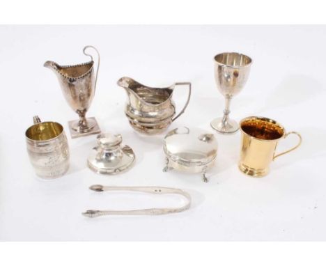 Selection of miscellaneous silver including a goblet, capstan inkwell, two christening mugs, helmet cream jug, trinket box, p