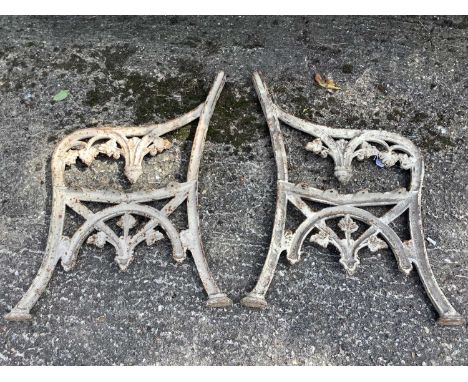 Pair of Victorian cast iron bench ends, with pierced scrolling leaf ornament, 83cm high
