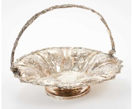 George III silver swing handled fruit basket of circular form, with panels of embossed floral decoration and engraved armoria