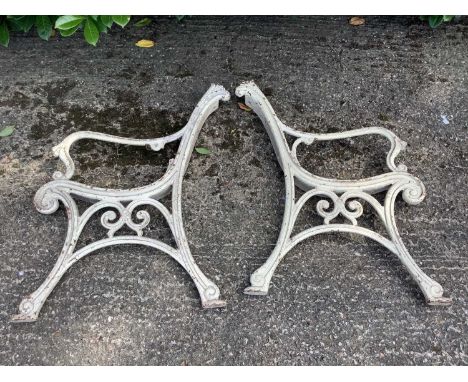 Pair of Victorian cast iron bench ends, with scrolling ornament, 89cm high