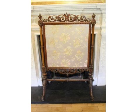 Good quality Victorian carved walnut and parcel gilt framed fire screen with pierced scroll cresting, turned and fluted suppo