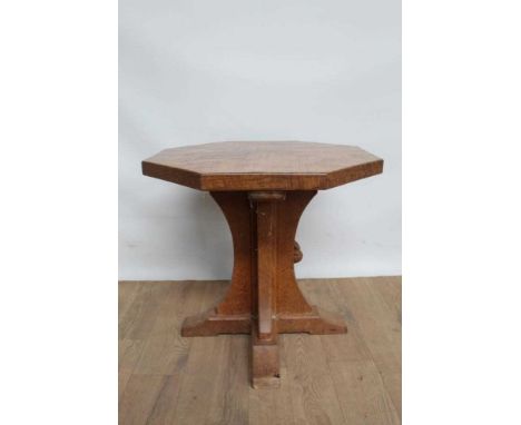 Robert Mouseman Thompson hexagonal side table, with figured brown oak top, on quatrefoil trestle support, signature carved mo