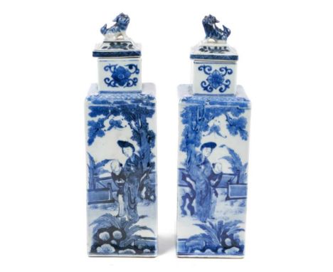 Pair of 19th century Chinese Kangxi style blue and white porcelain vases and covers of tall square form, with dog of foo knop