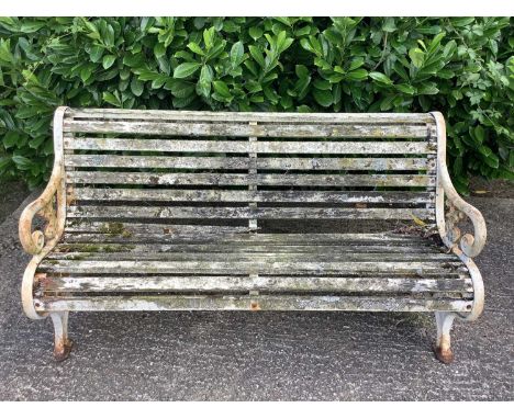 Victorian style cast iron garden bench with wooden slats