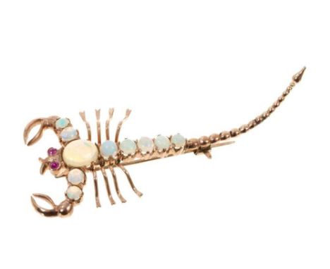 Novelty gold and opal brooch in the form of a scorpion with ruby eyes and opal cabochons in 9ct yellow gold setting, 60mm