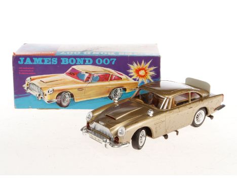 Gama James Bond 4900, Blech/Kunststoff, Uhrwerk intakt, LS, L 25, im leicht besch. OK, Z 3