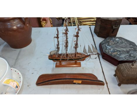 Pair of ship ornamentsPlease note this lot is not subject to VAT. The hammer price will still be subject to our buyer's premi