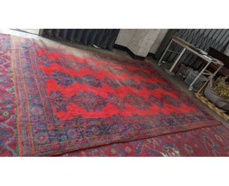 Red hand knotted Turkish rug, 3.9m x 2.7mPlease note this lot is not subject to VAT. The hammer price will still be subject t