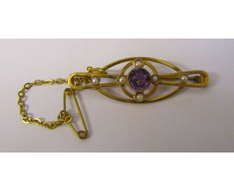 Tested as 9ct gold amethyst and seed pearl brooch with safety chain, amethyst 6.5 mm, L 4 cm, weight&nbsp; 2.3 g